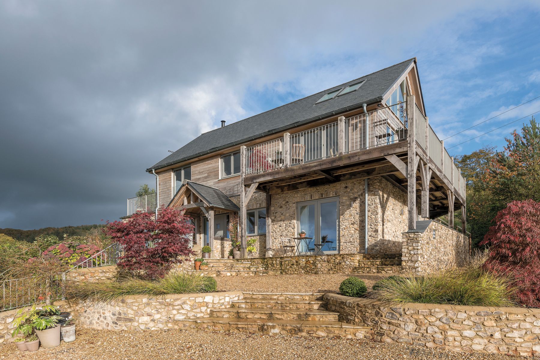 External view of timber-framed building by Carpenter Oak