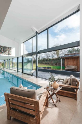 Seating next to swimming pool. The Plantation, North Devon 
