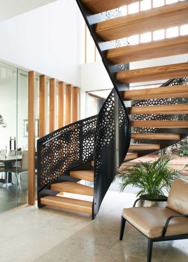 Barc Architects designed the staircase to allow plenty of light to flow through