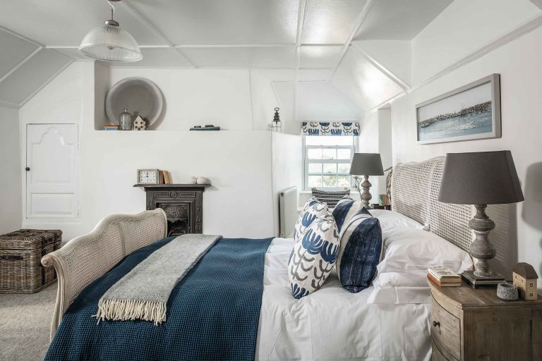 Calm bedroom interior in blue and white