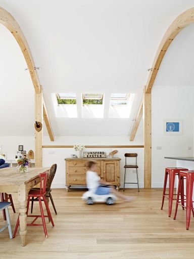 Rustic furniture sits well with the pared-back interior