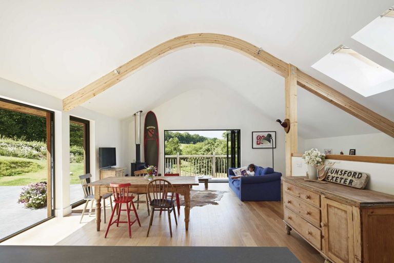 A high, vaulted ceiling soars over the main living area