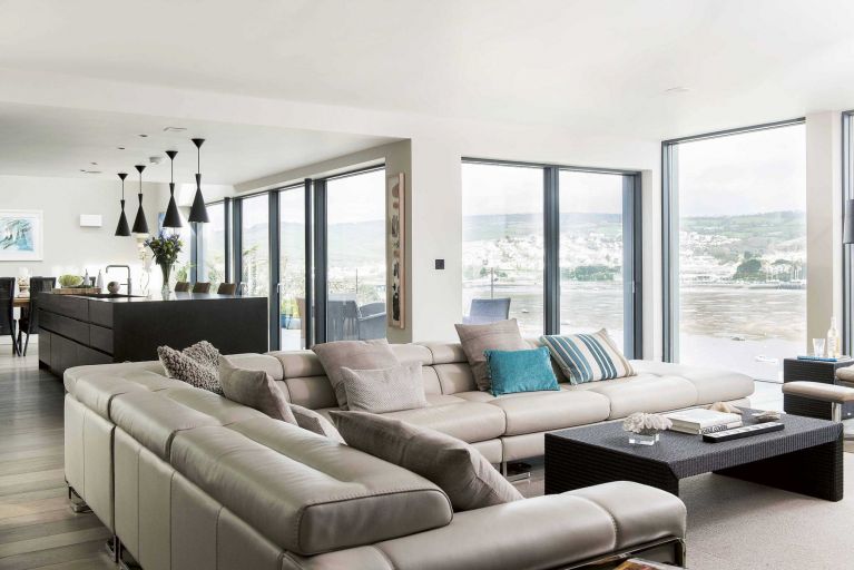 Huge expanses of glass fill each of the front rooms with light