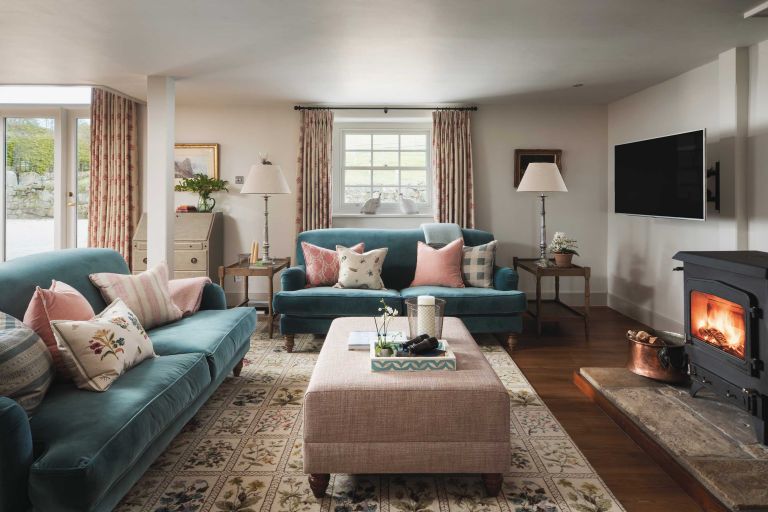 Pastourelle. Living room. Blue sofa with pink ottoman